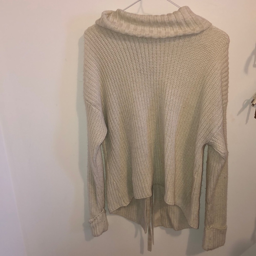 Small, white, American Rag sweater from Macy’s. This is a loose turtleneck.